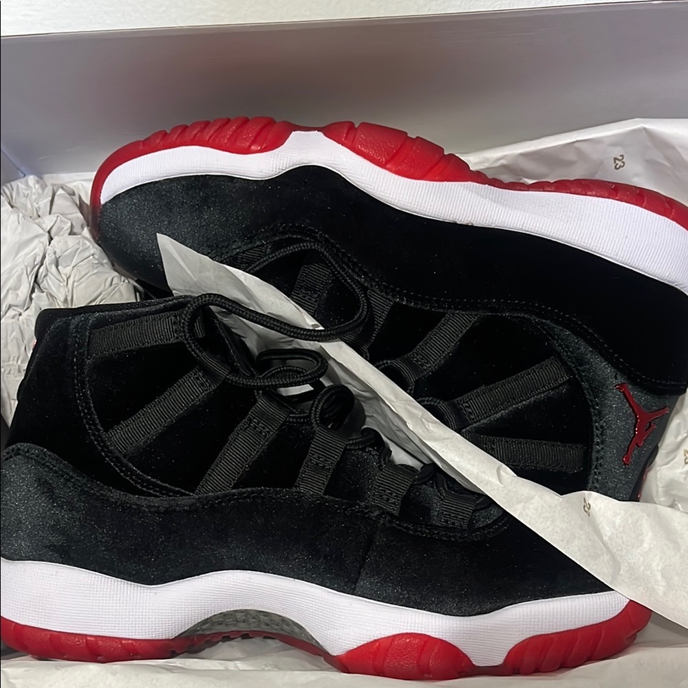 Jordan 11s womans Black and Red Sneakers